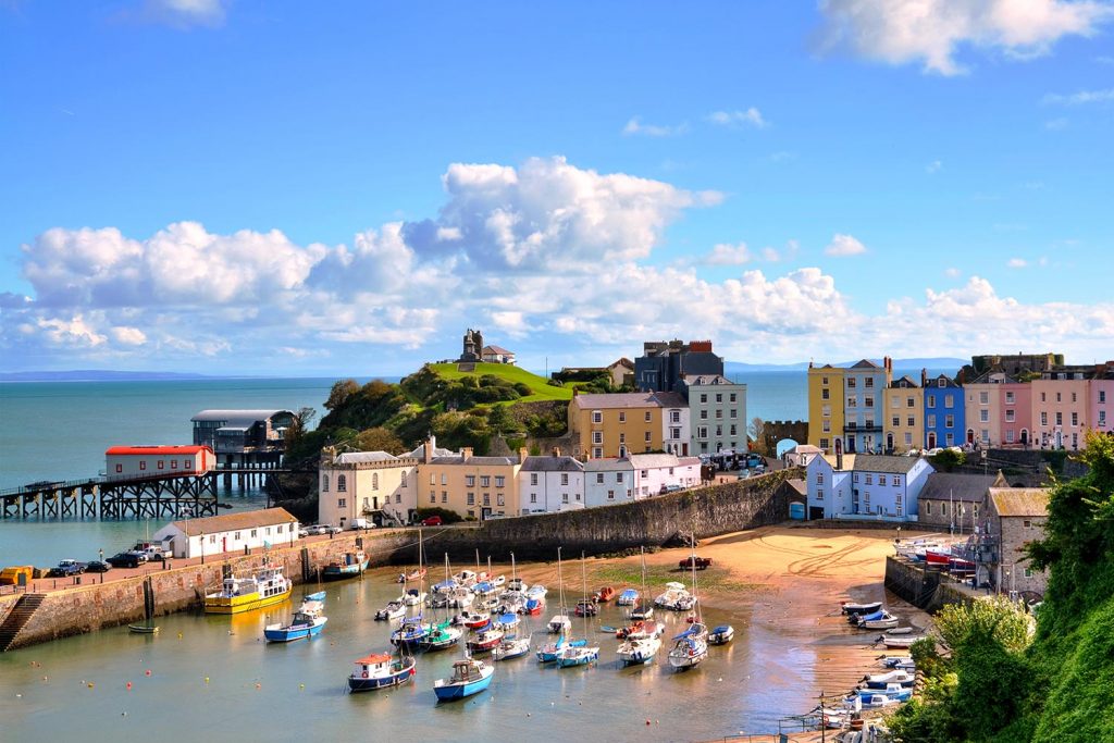 A beautiful view of the bay and village buildings in the seaside town of Tenby in Wales, the castle capital of the world.