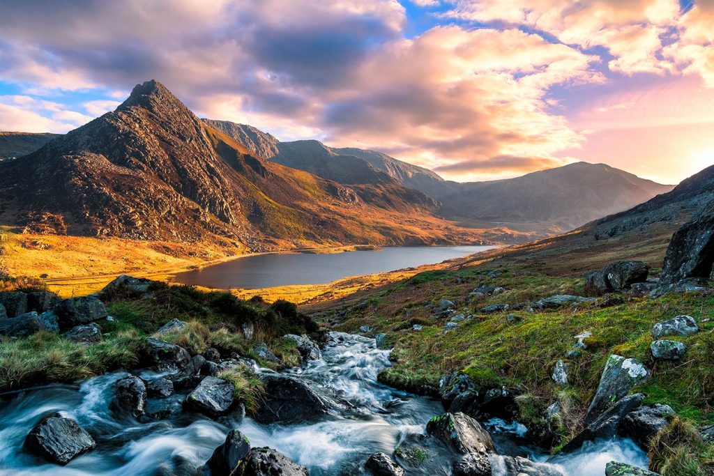 A sunset vista of Mount Tryfan in the Ogwen Valley, Snowdonia, Wales.