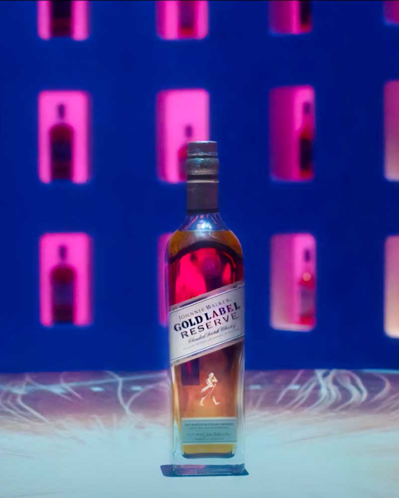 A bottle of Johnnie Walker with exciting lighting.